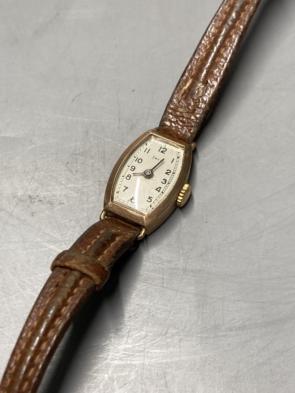 A 9ct gold vintage wristwatch with circular dial and subsidiary seconds dial (converted) and three other 9ct gold watches,